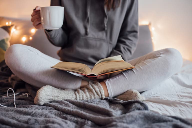 Girl reading bible at christian bed and breakfast in nj